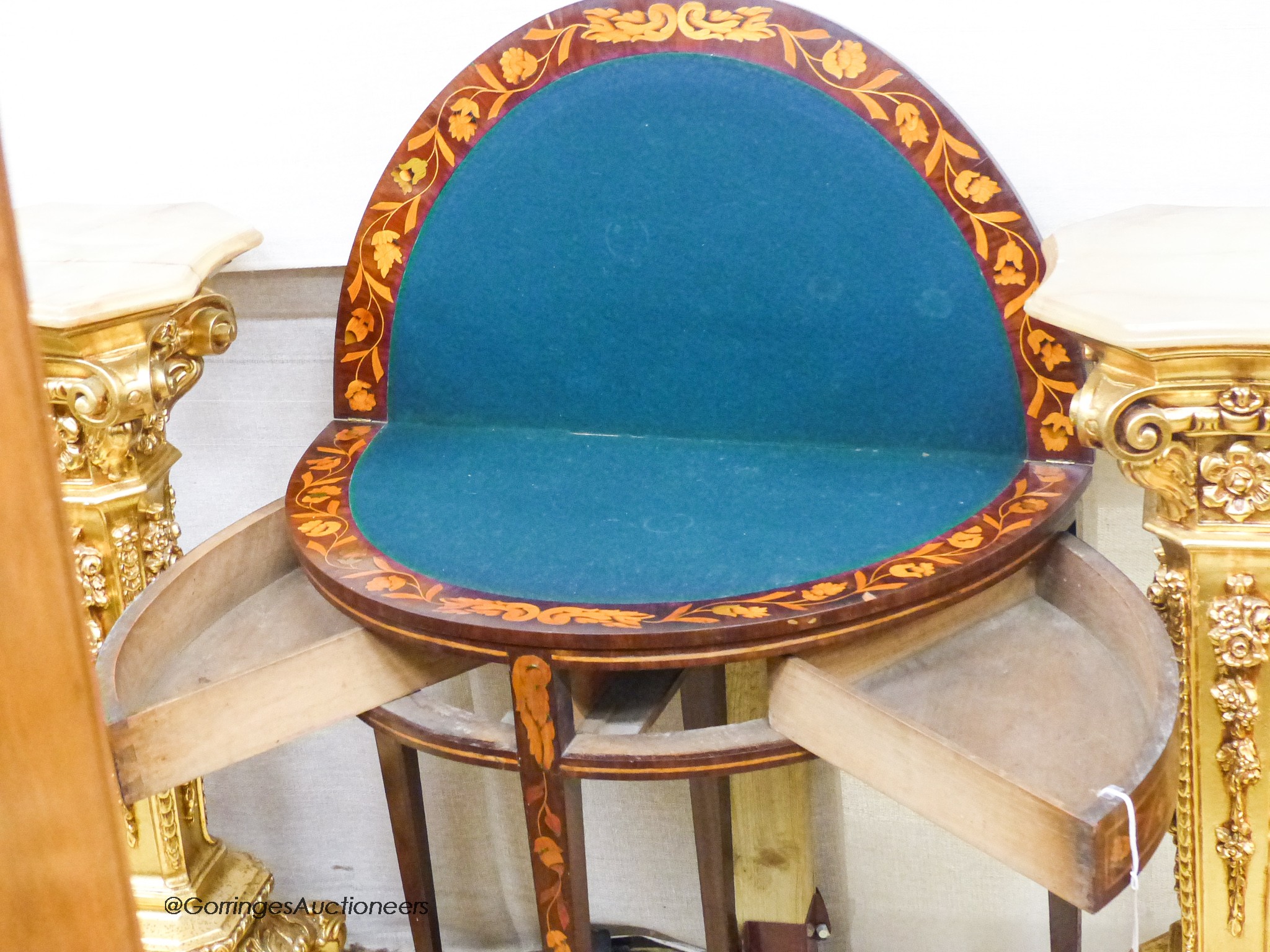 An early 19th century Dutch floral marquetry walnut D shaped folding card table, width 80cm, depth 45cm, height 76cm